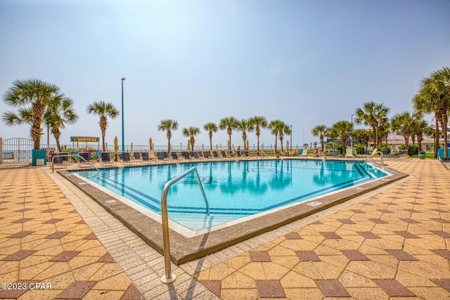 view of swimming pool with a patio