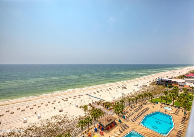 exterior space with a beach view and a water view