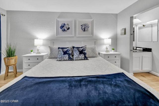 bedroom with light hardwood / wood-style flooring