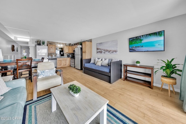 living room featuring light wood-type flooring