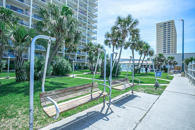 view of home's community featuring a lawn