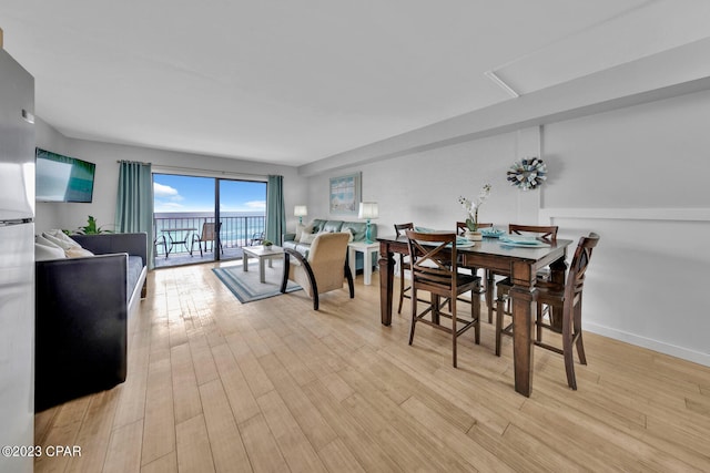 dining area featuring light wood-type flooring