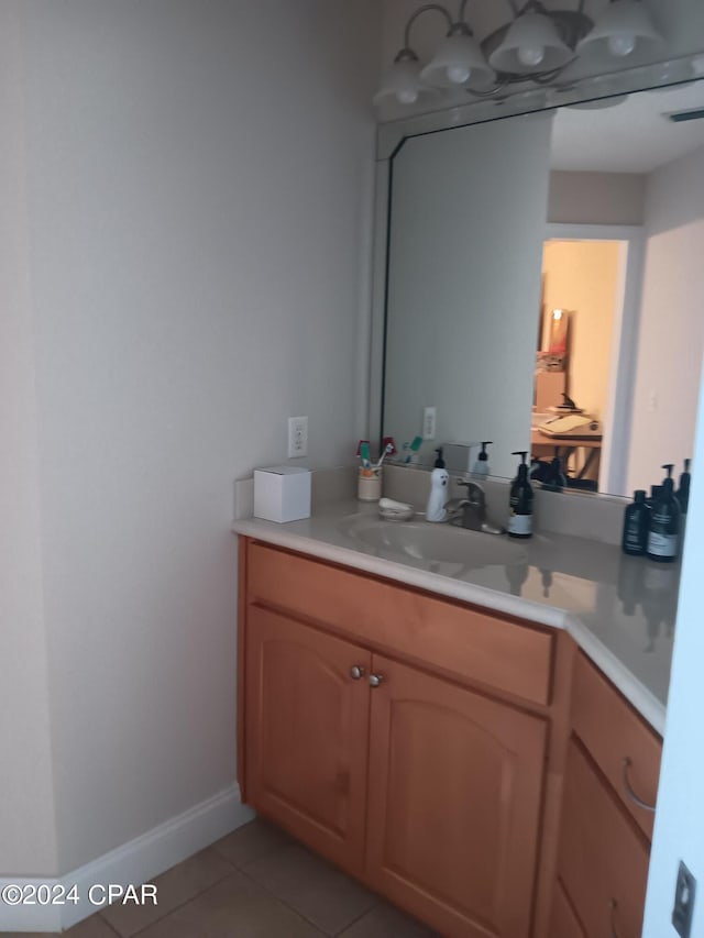 bathroom with tile patterned flooring and vanity