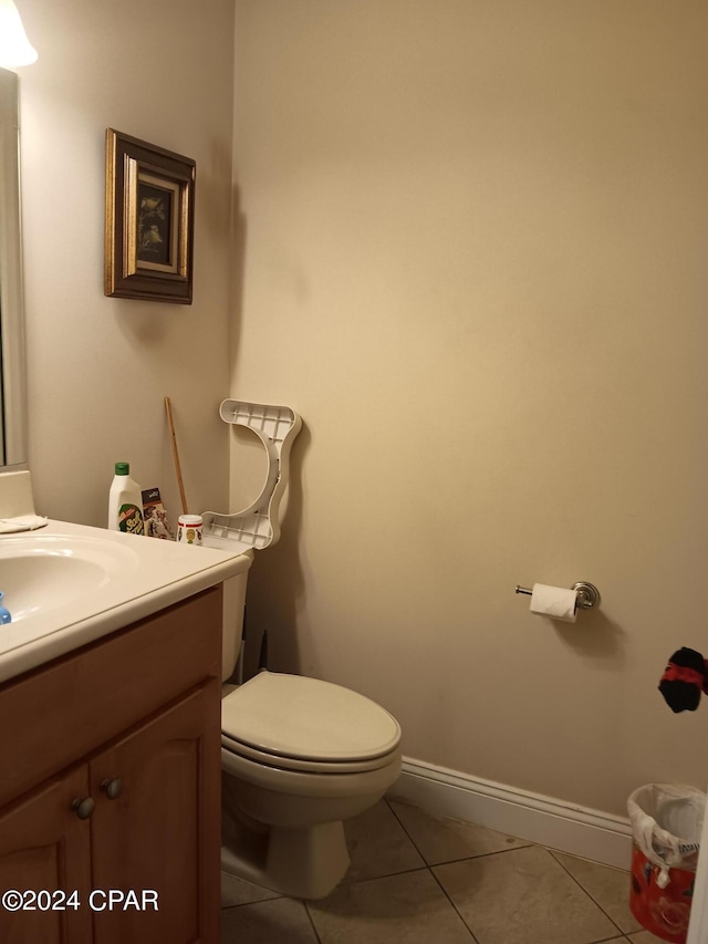 bathroom featuring vanity, toilet, and tile patterned floors