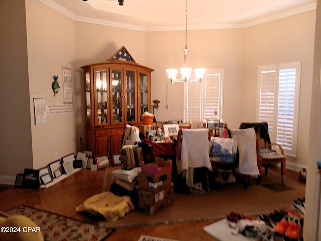 dining area featuring a chandelier, crown molding, and carpet floors