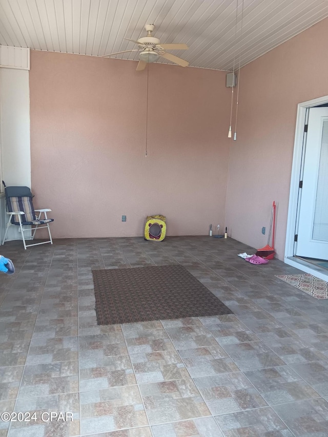 interior space featuring ceiling fan