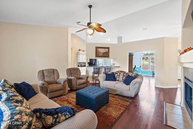 living room featuring high vaulted ceiling, ceiling fan, and dark wood-type flooring