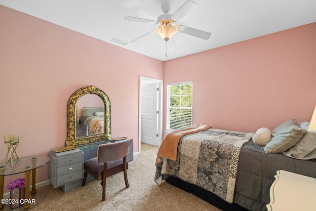 bedroom featuring light carpet and ceiling fan