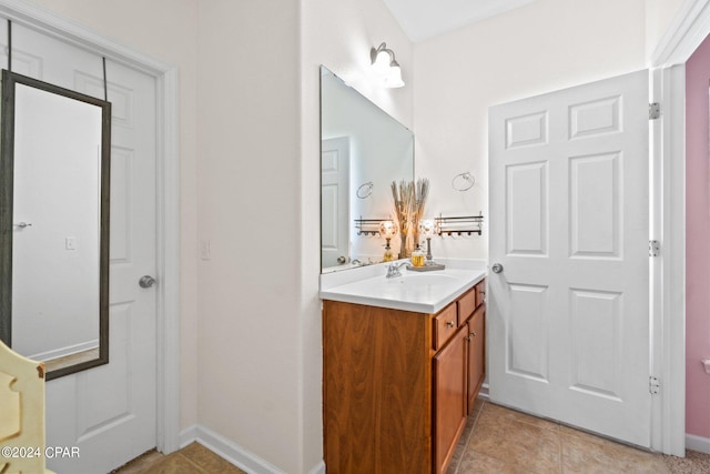 bathroom with tile patterned floors and vanity