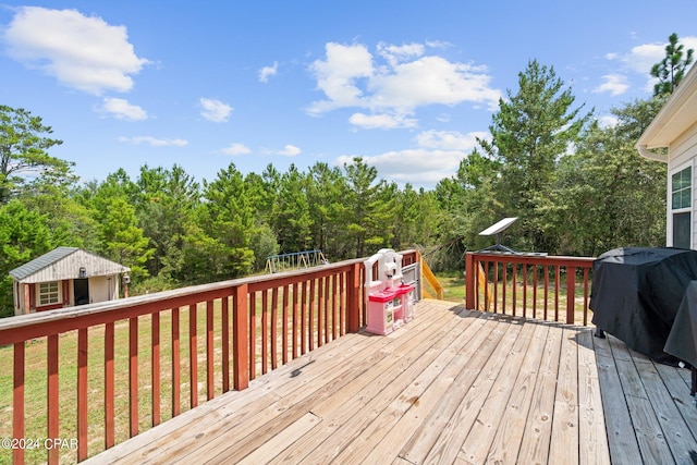 wooden terrace featuring a trampoline