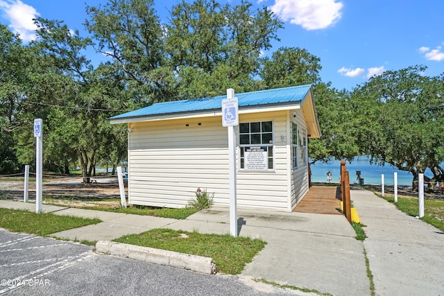 view of outbuilding featuring a water view