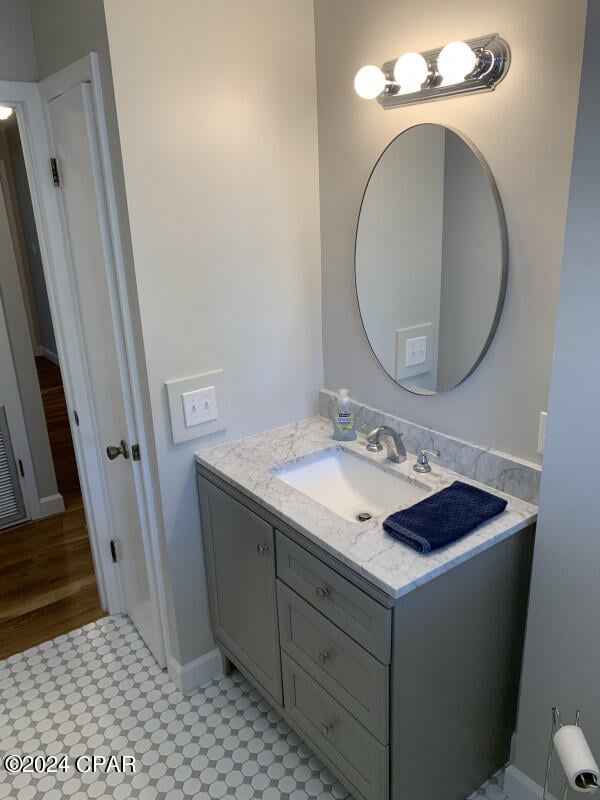 bathroom with vanity and tile patterned floors