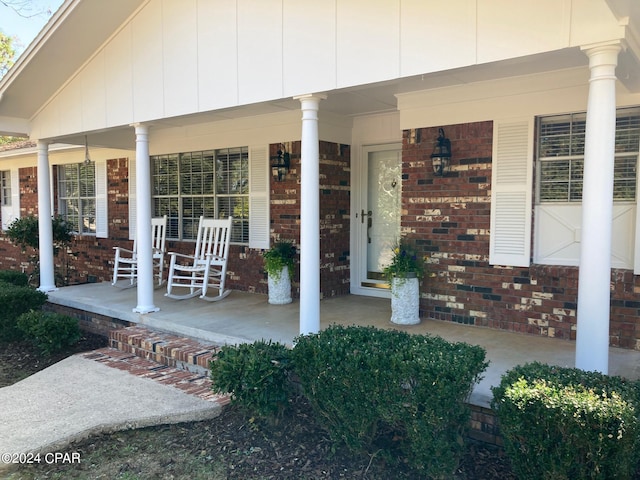 property entrance featuring covered porch