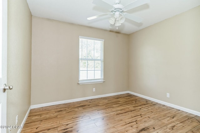 spare room featuring light hardwood / wood-style flooring and ceiling fan