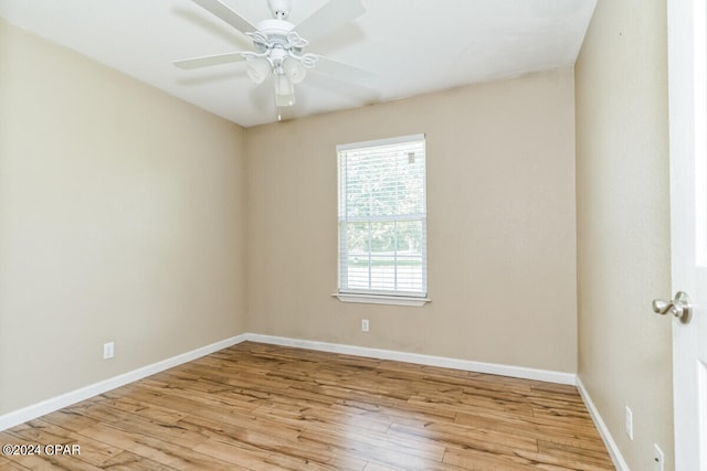 unfurnished room with ceiling fan and light hardwood / wood-style floors