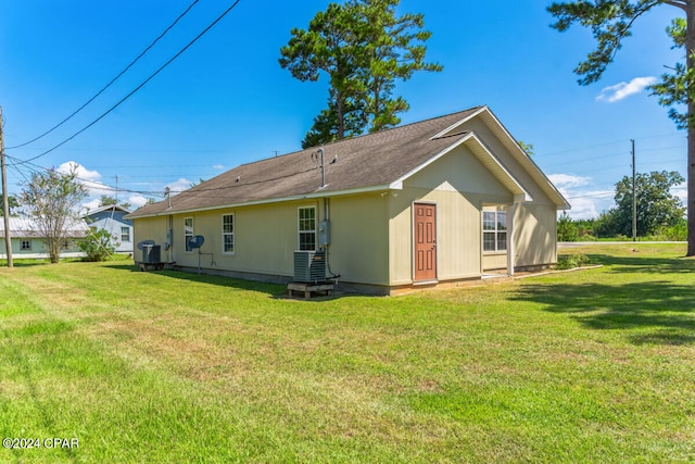 back of property with a yard