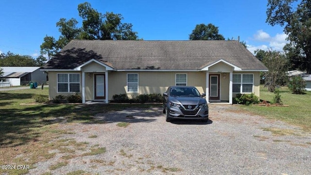 ranch-style house with a front yard