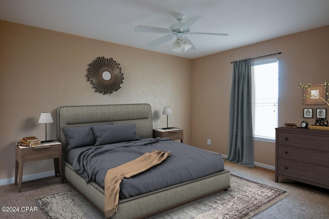 carpeted bedroom with multiple windows and ceiling fan