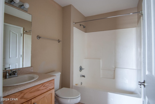 full bathroom featuring bathtub / shower combination, toilet, and vanity