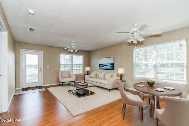 living room with hardwood / wood-style floors and ceiling fan