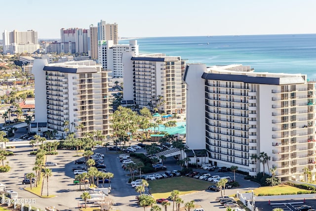 birds eye view of property with a water view and a city view