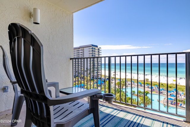 balcony with a view of the beach and a water view