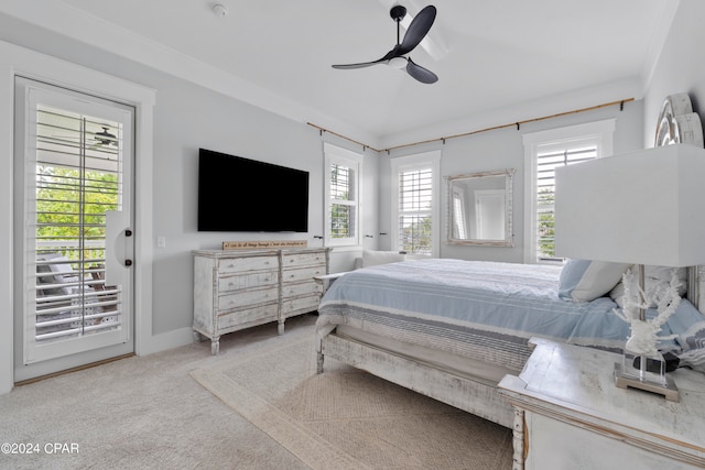 bedroom with multiple windows, access to outside, carpet flooring, and ceiling fan