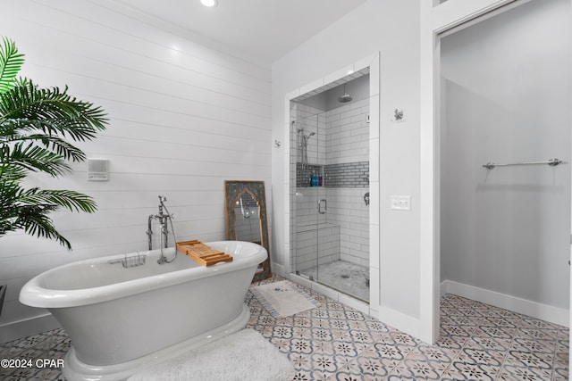 bathroom featuring separate shower and tub and tile patterned floors