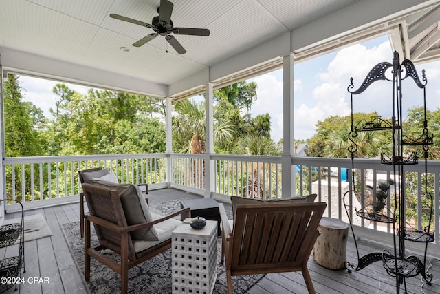 deck featuring ceiling fan and an outdoor hangout area