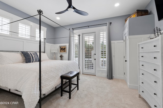 carpeted bedroom featuring access to outside and ceiling fan