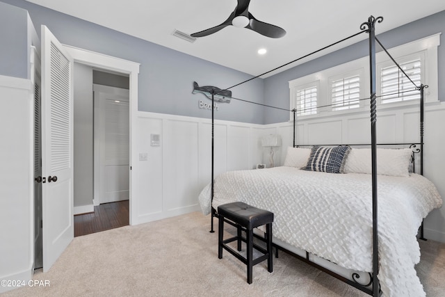 carpeted bedroom with ceiling fan