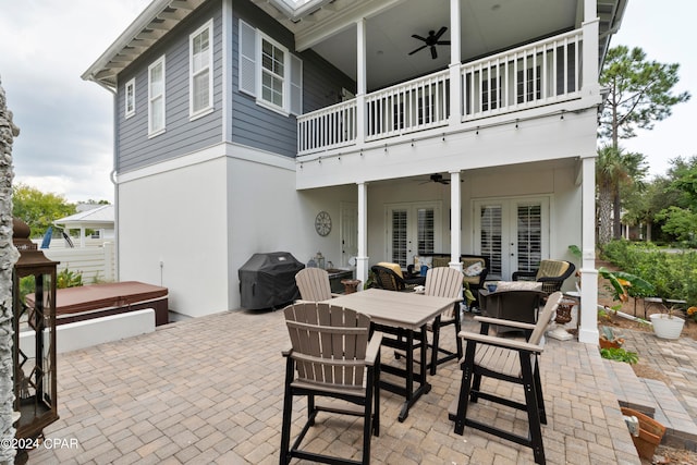 view of patio / terrace featuring a balcony, area for grilling, ceiling fan, and french doors