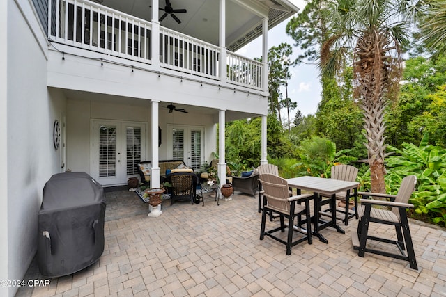 view of patio / terrace featuring ceiling fan, a balcony, an outdoor living space, and french doors