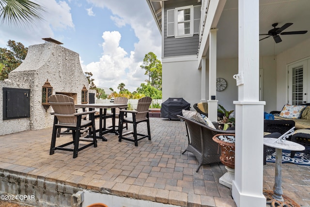 view of patio / terrace with area for grilling and ceiling fan