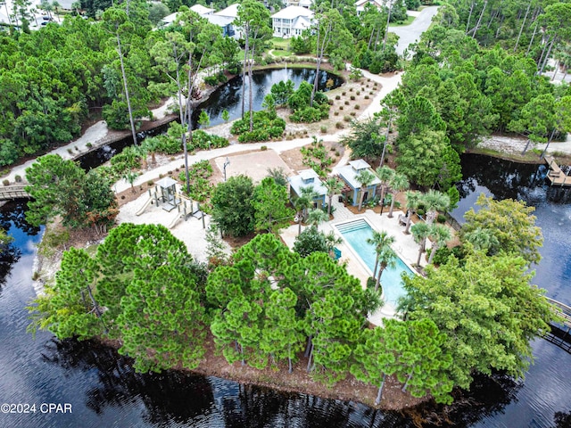 birds eye view of property with a water view