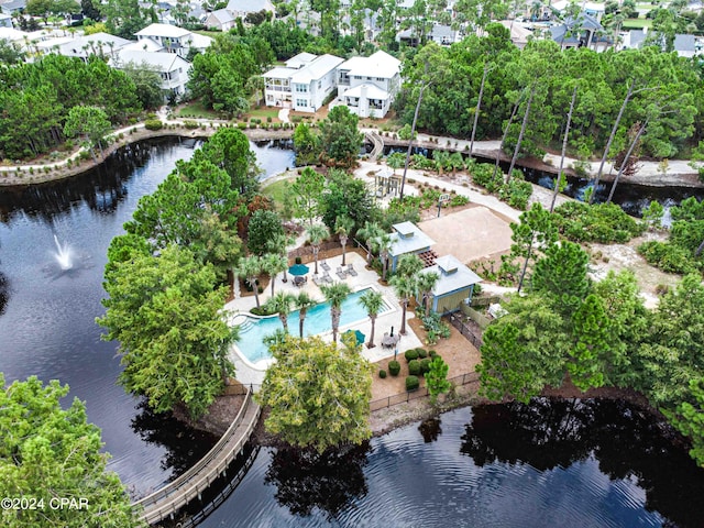 birds eye view of property with a water view