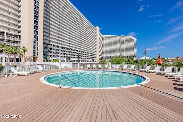 view of swimming pool with a patio