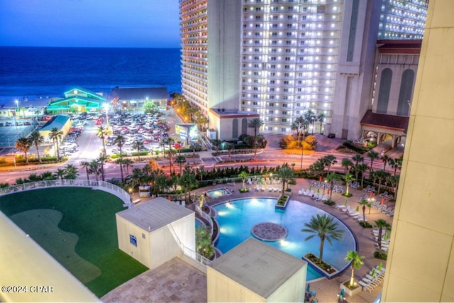 view of pool featuring a water view