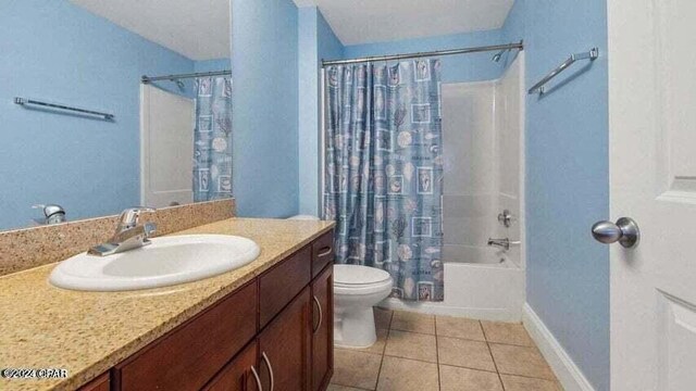 full bathroom featuring tile patterned floors, vanity, shower / tub combo, and toilet