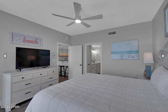 bedroom with connected bathroom, dark hardwood / wood-style floors, and ceiling fan