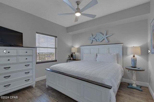 bedroom with ceiling fan and hardwood / wood-style flooring