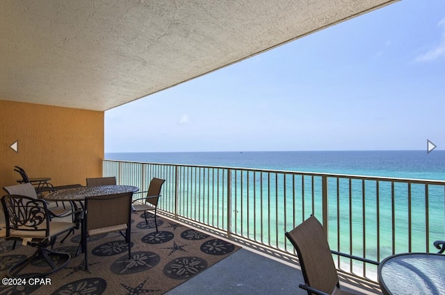 balcony featuring a water view