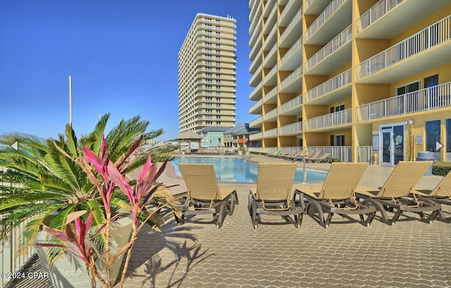 exterior space featuring a balcony and a community pool