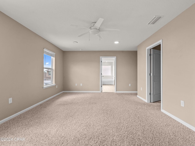 carpeted empty room with ceiling fan