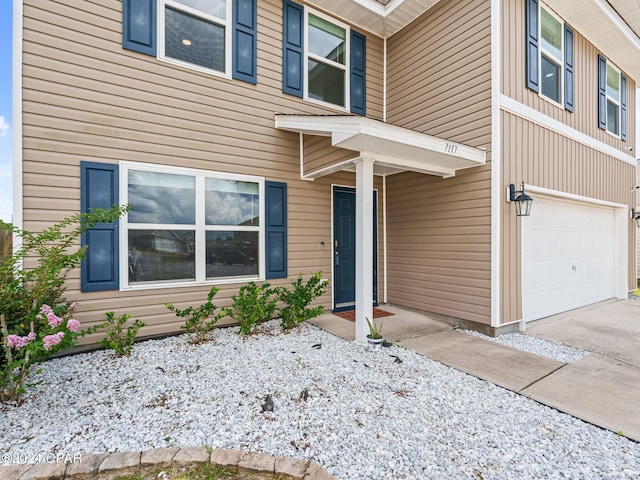 property entrance featuring a garage