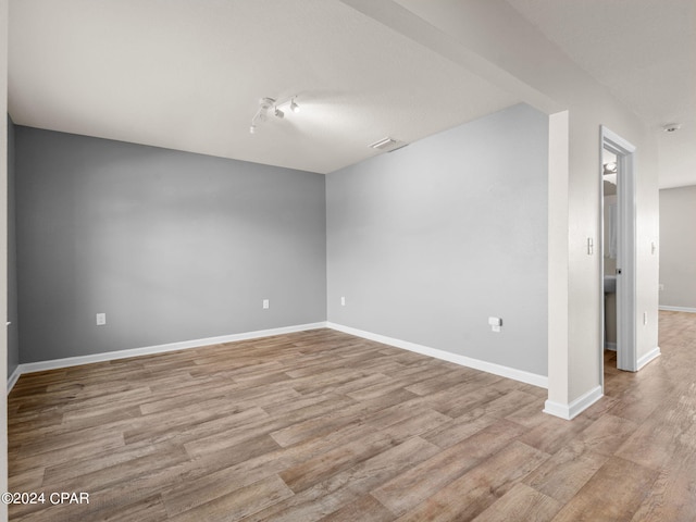 unfurnished room featuring light hardwood / wood-style floors