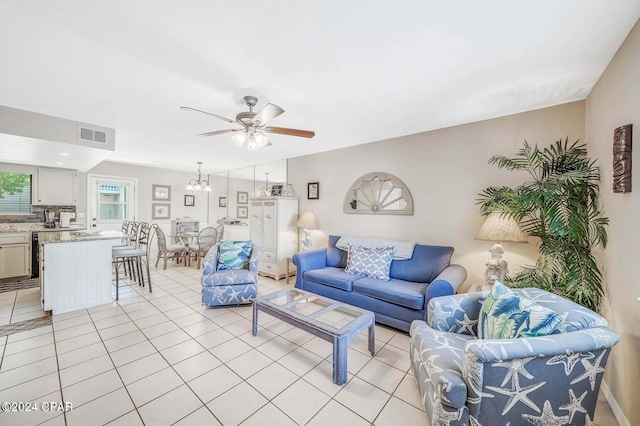 living room featuring ceiling fan and light tile patterned flooring