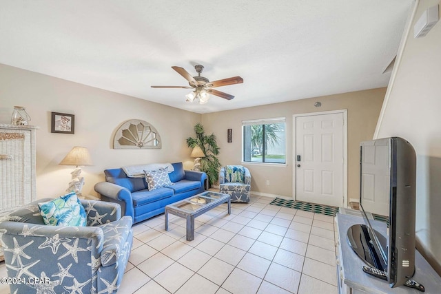 tiled living room with ceiling fan