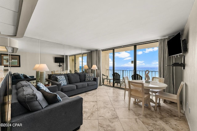 living room featuring a wealth of natural light and light tile patterned floors