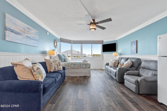 living room with a textured ceiling, ceiling fan, crown molding, and dark hardwood / wood-style flooring